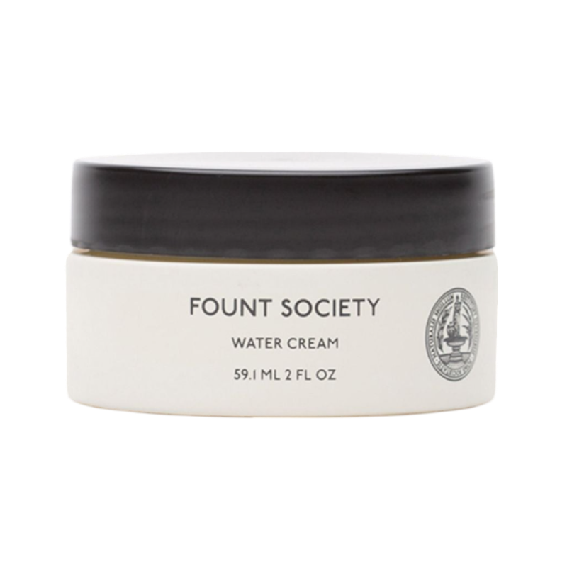 The taupe-colored Bubble Cuddle Blanket by Cozy Earth, with its soft and folded faux fur surface, sits against a white background, highlighting its plush texture. |Color:Walnut