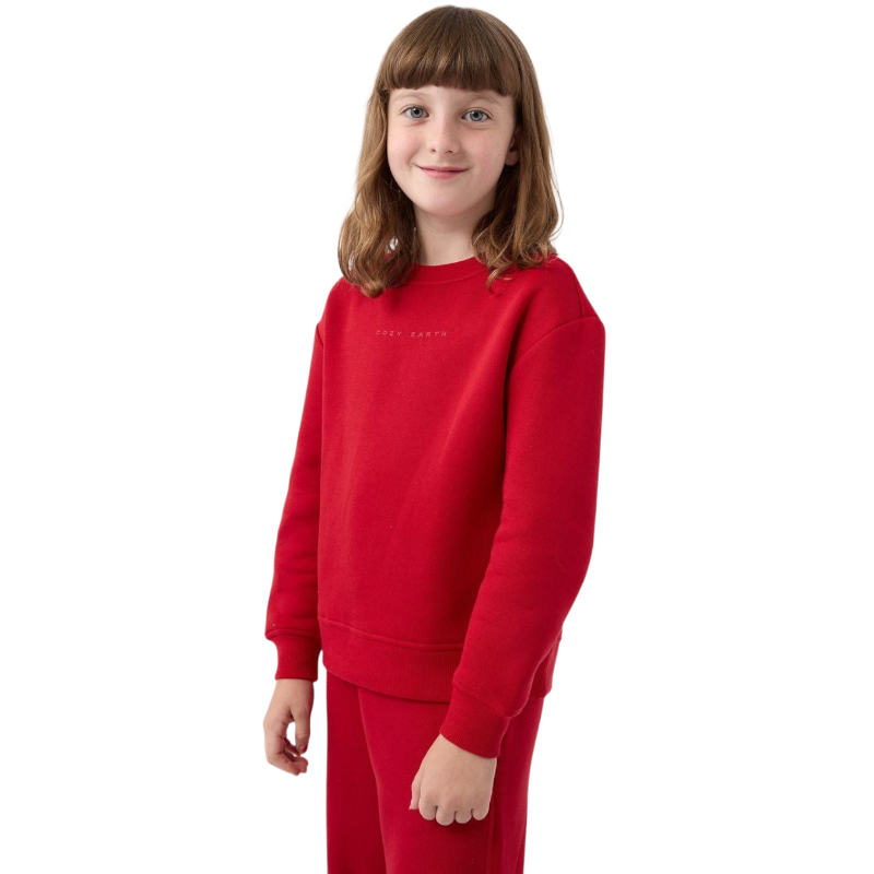 A young boy with blond hair is wearing the Cozy Earth Kid's CityScape Crewneck sweatshirt along with matching pants. He is standing, smiling, and looking slightly to the side against a plain white background. |Color:Eclipse