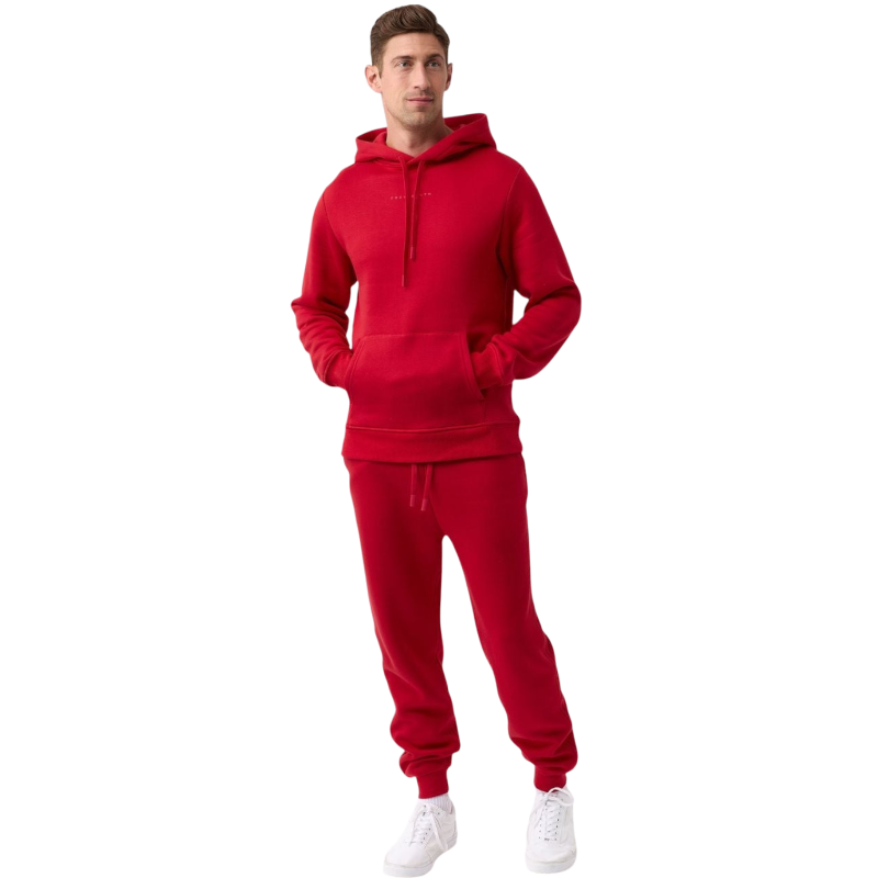 A person with curly hair is wearing a Cozy Earth Men's CityScape Hoodie in dark green and standing against a plain white background, with their hands together. |Color:Spruce