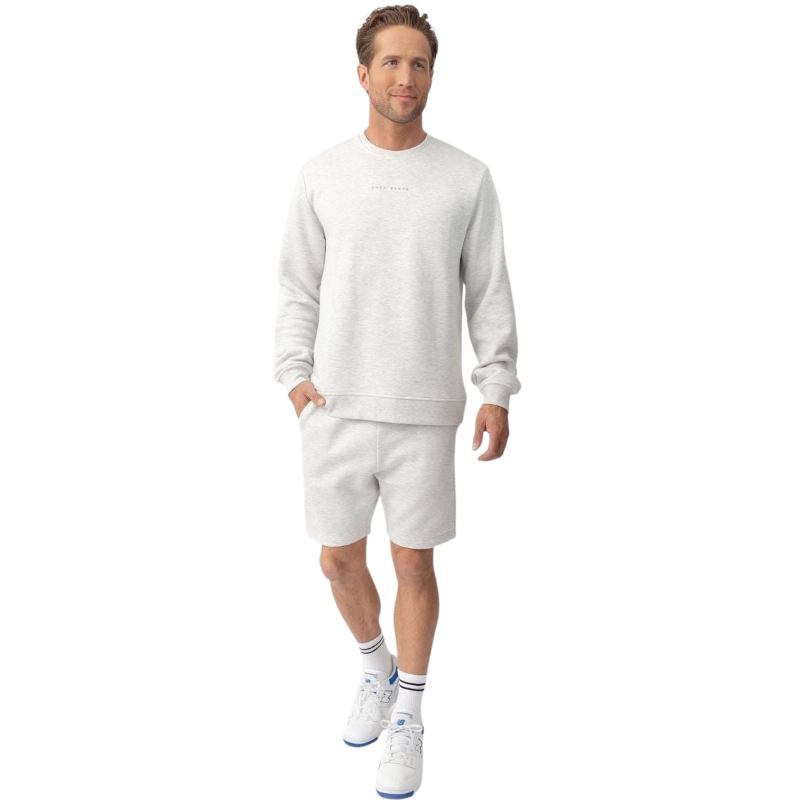 A man with short brown hair is wearing a dark green Men's CityScape Crewneck from Cozy Earth, featuring the words "COLD EARTH" printed on it. He is gazing slightly to the side against a plain white background. |Color:Spruce