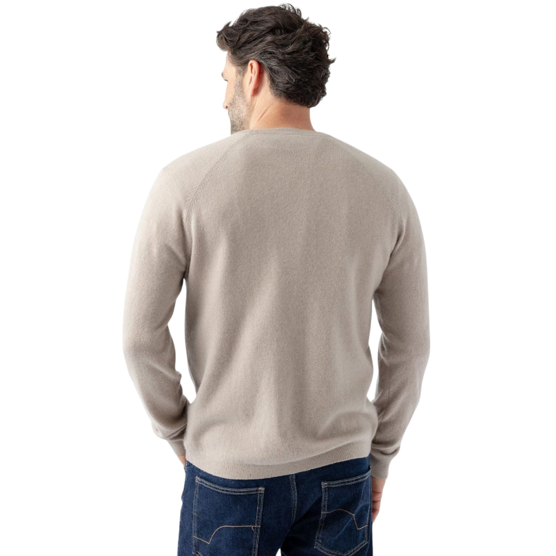 A man with dark hair and a beard stands casually with his hands in his pockets. He is wearing the Cozy Earth Men's Crewneck Sweater in navy blue, paired with gray pants. He looks at the camera with a neutral expression, set against a plain white background. |Color:Eclipse
