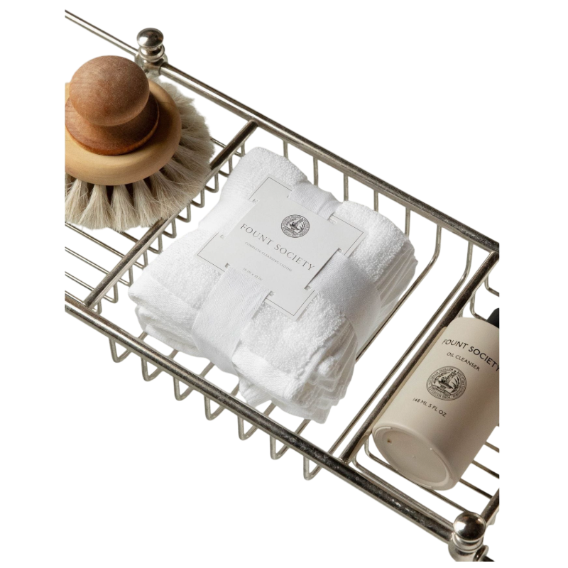 The taupe-colored Bubble Cuddle Blanket by Cozy Earth, with its soft and folded faux fur surface, sits against a white background, highlighting its plush texture. |Color:Walnut