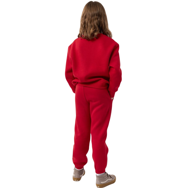 A young boy with blond hair is wearing the Cozy Earth Kid's CityScape Crewneck sweatshirt along with matching pants. He is standing, smiling, and looking slightly to the side against a plain white background. |Color:Eclipse