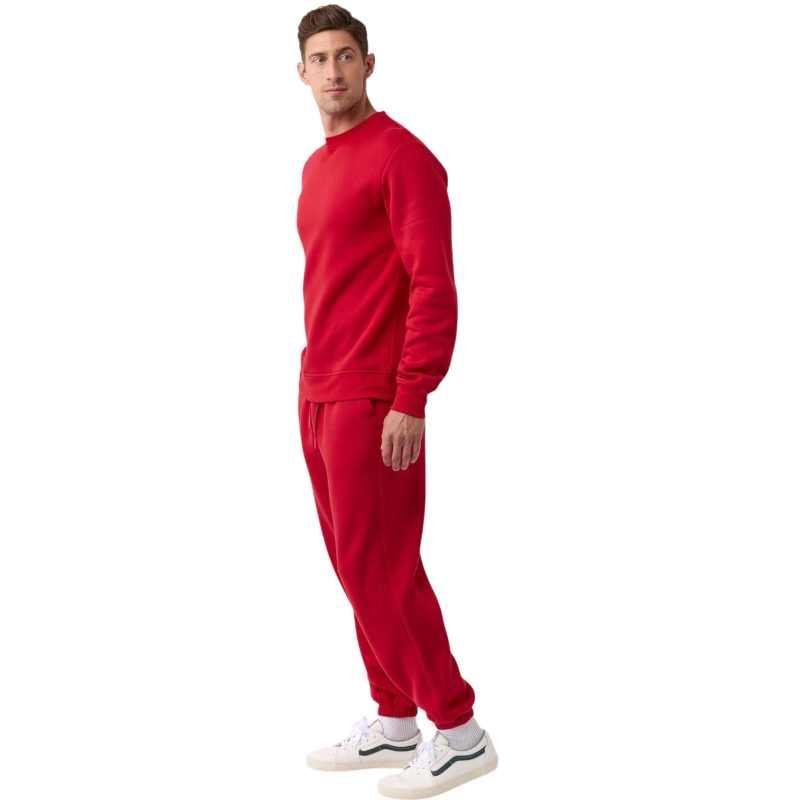 A man with short brown hair is wearing a dark green Men's CityScape Crewneck from Cozy Earth, featuring the words "COLD EARTH" printed on it. He is gazing slightly to the side against a plain white background. |Color:Spruce