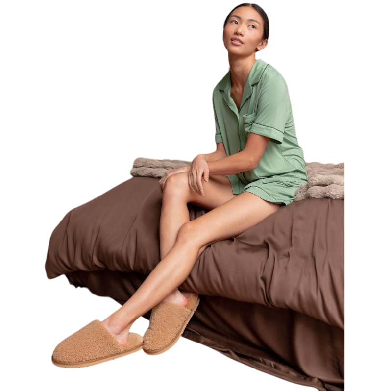 A pair of Puffy Sheep Slippers by Cozy Earth, featuring a cozy tan design with a fuzzy, textured exterior and soft interior, crafted in a slip-on style with rubber soles, set against a plain white background. |Color:Fawn