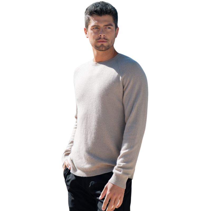 A man with dark hair and a beard stands casually with his hands in his pockets. He is wearing the Cozy Earth Men's Crewneck Sweater in navy blue, paired with gray pants. He looks at the camera with a neutral expression, set against a plain white background. |Color:Eclipse