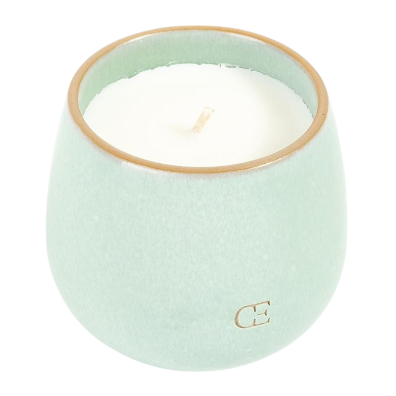 A young child with long blonde hair smiles while wearing a navy blue Kid's CityScape Hoodie by Cozy Earth and matching pants. She has two hair ties, one pink and one blue. The background is plain white. |Color:Eclipse