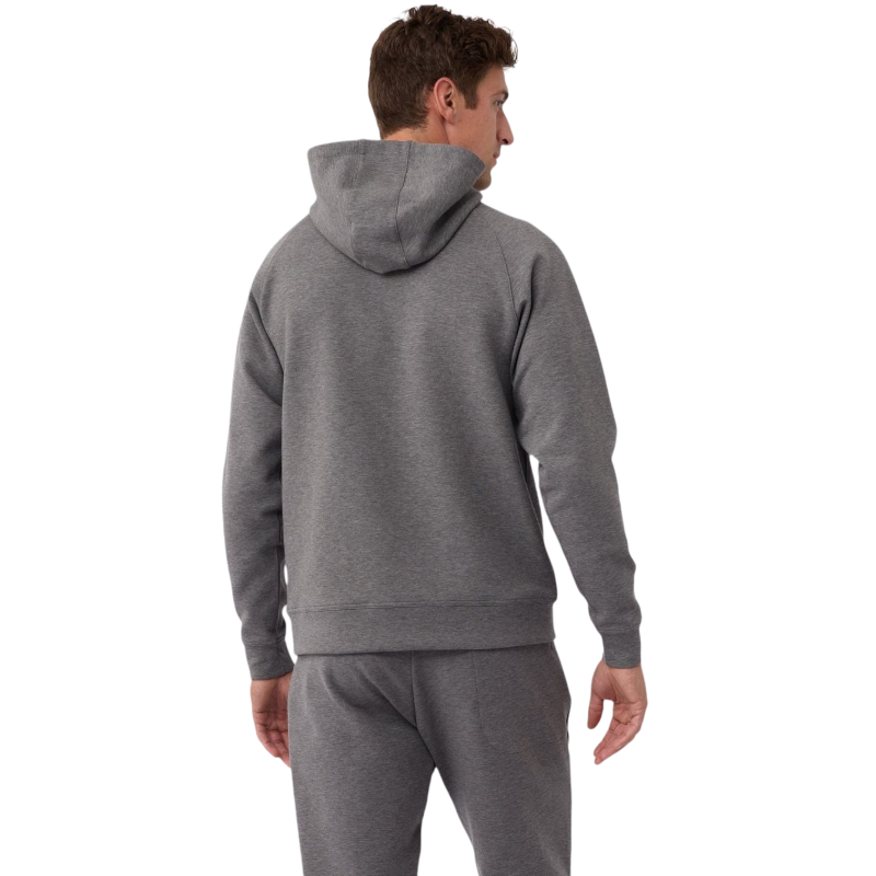 A person wearing the Men's StretchTech Hoodie from Cozy Earth, paired with matching gray pants, stands against a plain white background. The hoodie features drawstrings and a front pocket. The individual is looking forward with a neutral expression. |Color:Coal Heather