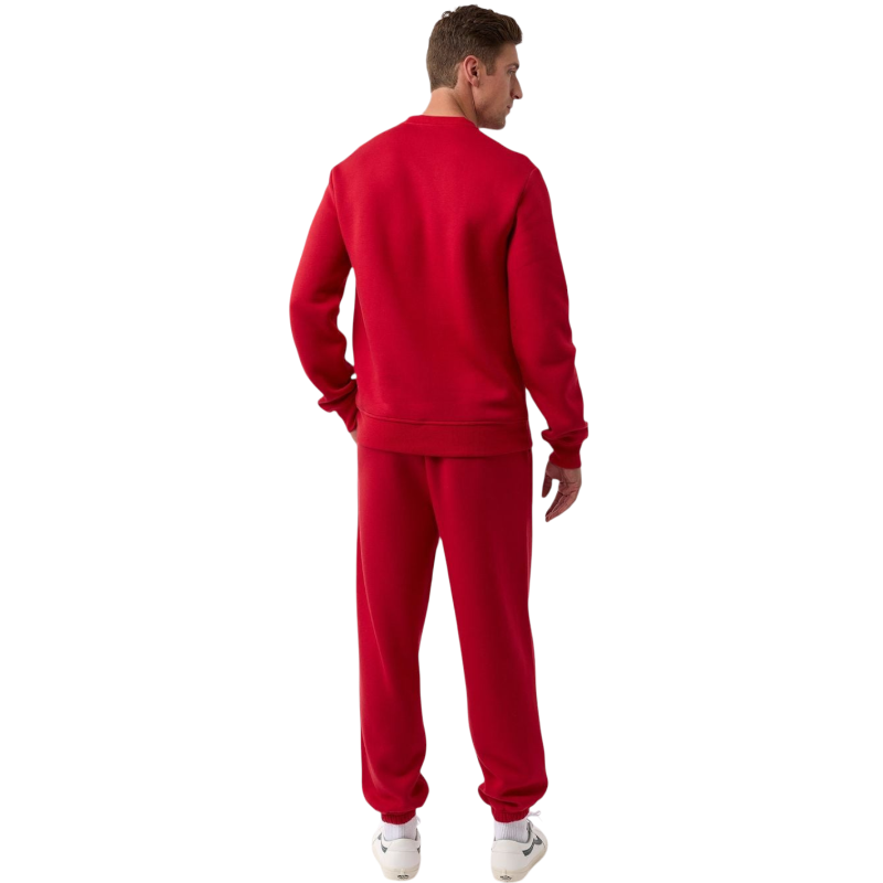 A man with short brown hair is wearing a dark green Men's CityScape Crewneck from Cozy Earth, featuring the words "COLD EARTH" printed on it. He is gazing slightly to the side against a plain white background. |Color:Spruce