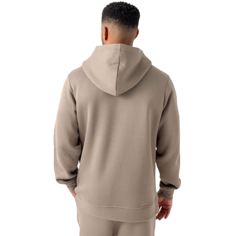 A person with curly hair is wearing a Cozy Earth Men's CityScape Hoodie in dark green and standing against a plain white background, with their hands together. |Color:Spruce