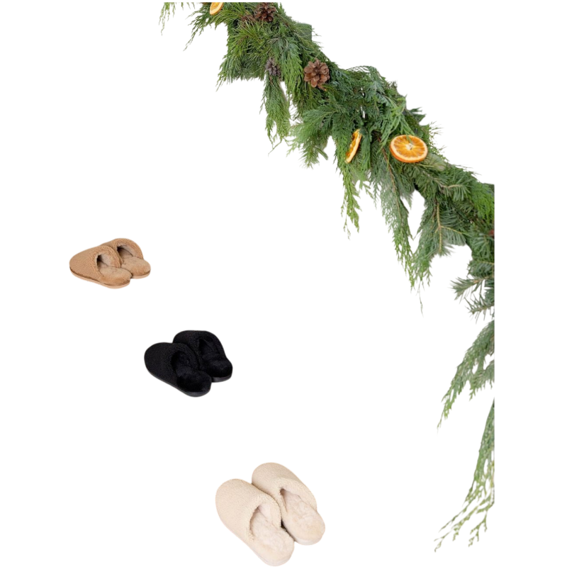 A pair of Puffy Sheep Slippers by Cozy Earth, featuring a cozy tan design with a fuzzy, textured exterior and soft interior, crafted in a slip-on style with rubber soles, set against a plain white background. |Color:Fawn