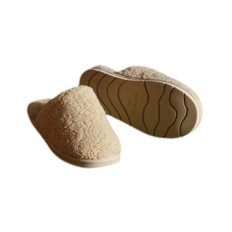 A pair of Puffy Sheep Slippers by Cozy Earth, featuring a cozy tan design with a fuzzy, textured exterior and soft interior, crafted in a slip-on style with rubber soles, set against a plain white background. |Color:Fawn