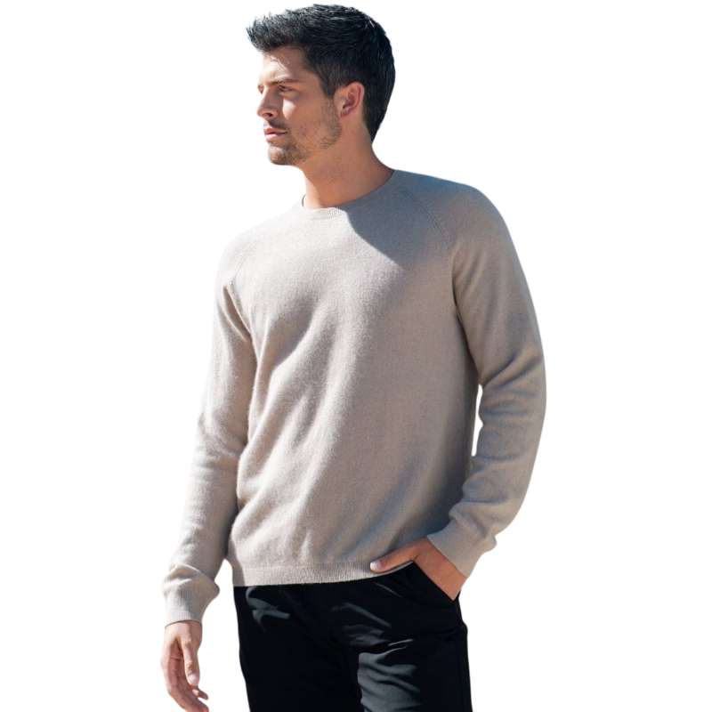 A man with dark hair and a beard stands casually with his hands in his pockets. He is wearing the Cozy Earth Men's Crewneck Sweater in navy blue, paired with gray pants. He looks at the camera with a neutral expression, set against a plain white background. |Color:Eclipse