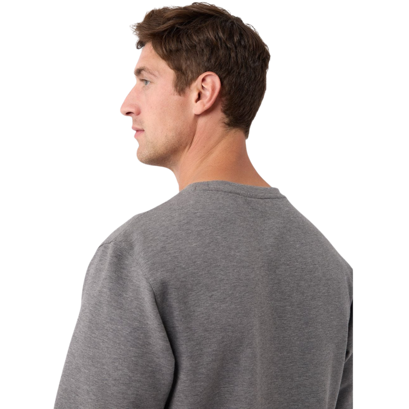 A man is wearing the Men's StretchTech Crewneck sweatshirt from Cozy Earth, paired with matching sweatpants. He stands against a plain white background with short brown hair, looking forward with a neutral expression. |Color:Coal Heather