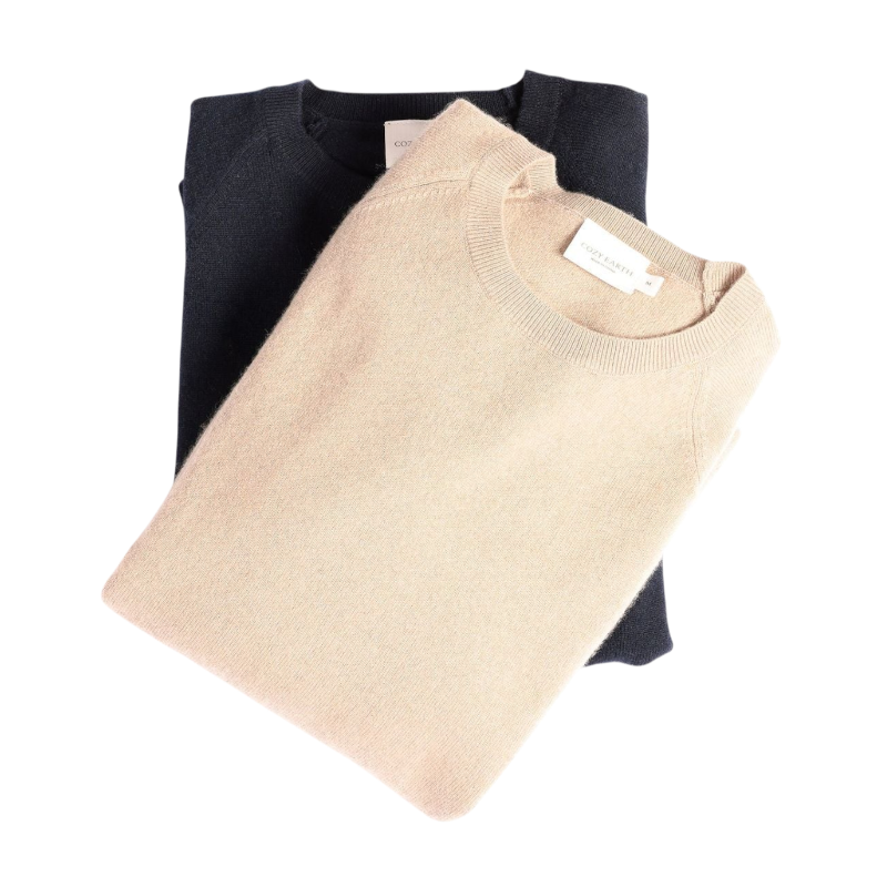 A man with dark hair and a beard stands casually with his hands in his pockets. He is wearing the Cozy Earth Men's Crewneck Sweater in navy blue, paired with gray pants. He looks at the camera with a neutral expression, set against a plain white background. |Color:Eclipse