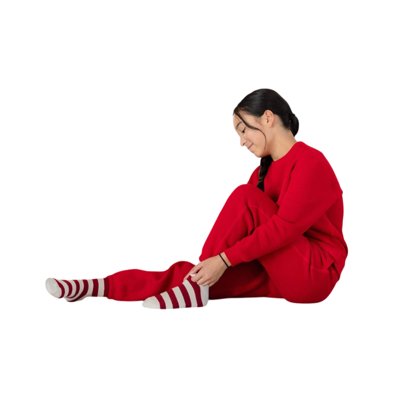 A young boy with blond hair is wearing the Cozy Earth Kid's CityScape Crewneck sweatshirt along with matching pants. He is standing, smiling, and looking slightly to the side against a plain white background. |Color:Eclipse