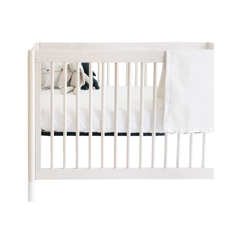 White baby blanket with knitted stuffed bunny