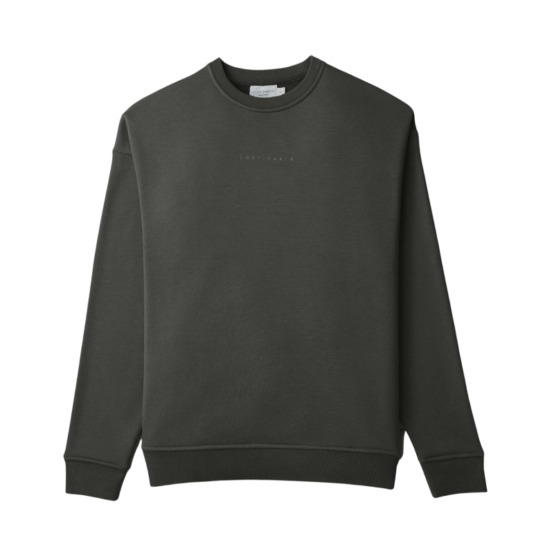 A person with curly hair models the Cozy Earth Women's CityScape Crewneck and matching pants in light pink against a plain white backdrop. |Color:Peony