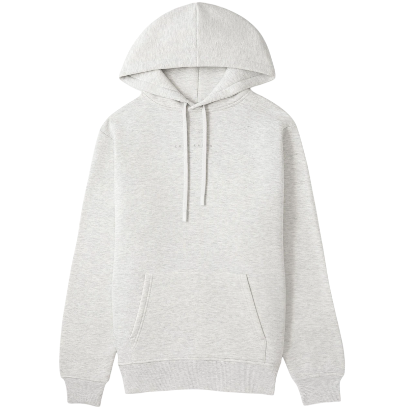 A person with curly hair is wearing a Cozy Earth Men's CityScape Hoodie in dark green and standing against a plain white background, with their hands together. |Color:Spruce