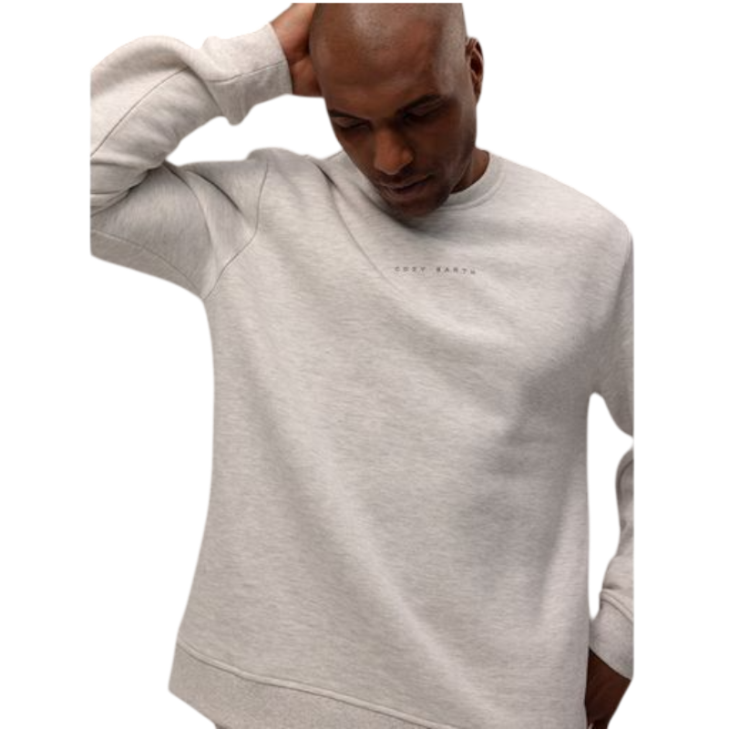 A man with short brown hair is wearing a dark green Men's CityScape Crewneck from Cozy Earth, featuring the words "COLD EARTH" printed on it. He is gazing slightly to the side against a plain white background. |Color:Spruce