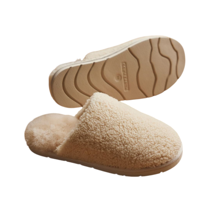 A pair of Puffy Sheep Slippers by Cozy Earth, featuring a cozy tan design with a fuzzy, textured exterior and soft interior, crafted in a slip-on style with rubber soles, set against a plain white background. |Color:Fawn