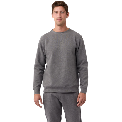A man is wearing the Men's StretchTech Crewneck sweatshirt from Cozy Earth, paired with matching sweatpants. He stands against a plain white background with short brown hair, looking forward with a neutral expression. |Color:Coal Heather