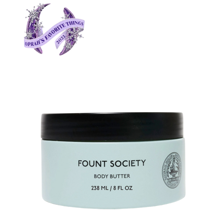 A man with dark hair and a beard stands casually with his hands in his pockets. He is wearing the Cozy Earth Men's Crewneck Sweater in navy blue, paired with gray pants. He looks at the camera with a neutral expression, set against a plain white background. |Color:Eclipse