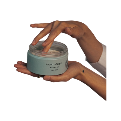 A man with dark hair and a beard stands casually with his hands in his pockets. He is wearing the Cozy Earth Men's Crewneck Sweater in navy blue, paired with gray pants. He looks at the camera with a neutral expression, set against a plain white background. |Color:Eclipse