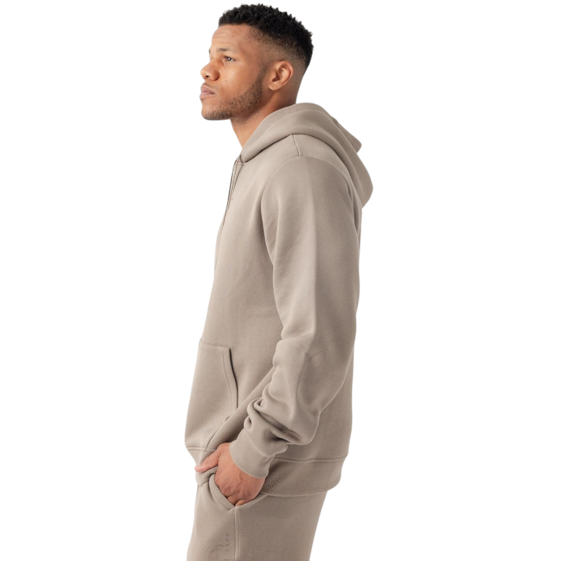 A person with curly hair is wearing a Cozy Earth Men's CityScape Hoodie in dark green and standing against a plain white background, with their hands together. |Color:Spruce