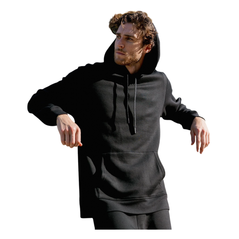 A person with curly hair is wearing a Cozy Earth Men's CityScape Hoodie in dark green and standing against a plain white background, with their hands together. |Color:Spruce