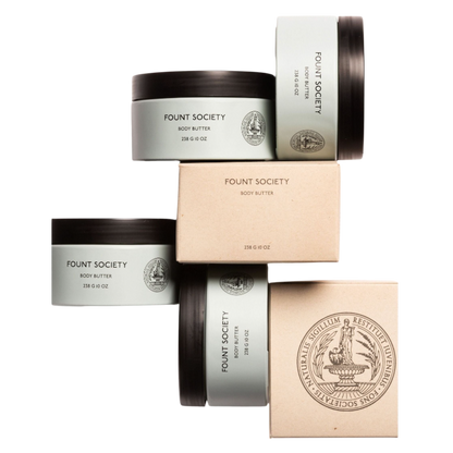 A man with dark hair and a beard stands casually with his hands in his pockets. He is wearing the Cozy Earth Men's Crewneck Sweater in navy blue, paired with gray pants. He looks at the camera with a neutral expression, set against a plain white background. |Color:Eclipse