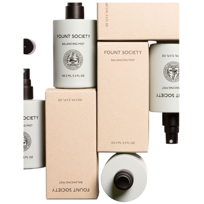 The taupe-colored Bubble Cuddle Blanket by Cozy Earth, with its soft and folded faux fur surface, sits against a white background, highlighting its plush texture. |Color:Walnut