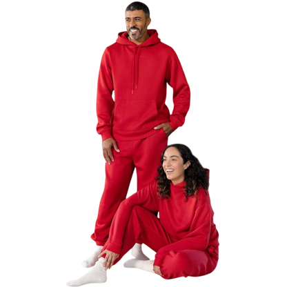 A person with curly hair is wearing a Cozy Earth Men's CityScape Hoodie in dark green and standing against a plain white background, with their hands together. |Color:Spruce