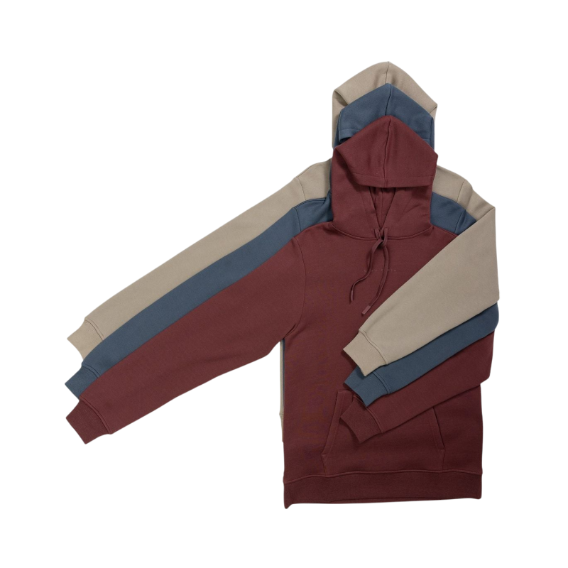 A person with curly hair is wearing a Cozy Earth Men's CityScape Hoodie in dark green and standing against a plain white background, with their hands together. |Color:Spruce