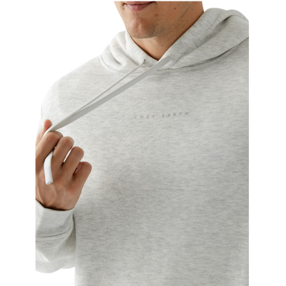 A person with curly hair is wearing a Cozy Earth Men's CityScape Hoodie in dark green and standing against a plain white background, with their hands together. |Color:Spruce