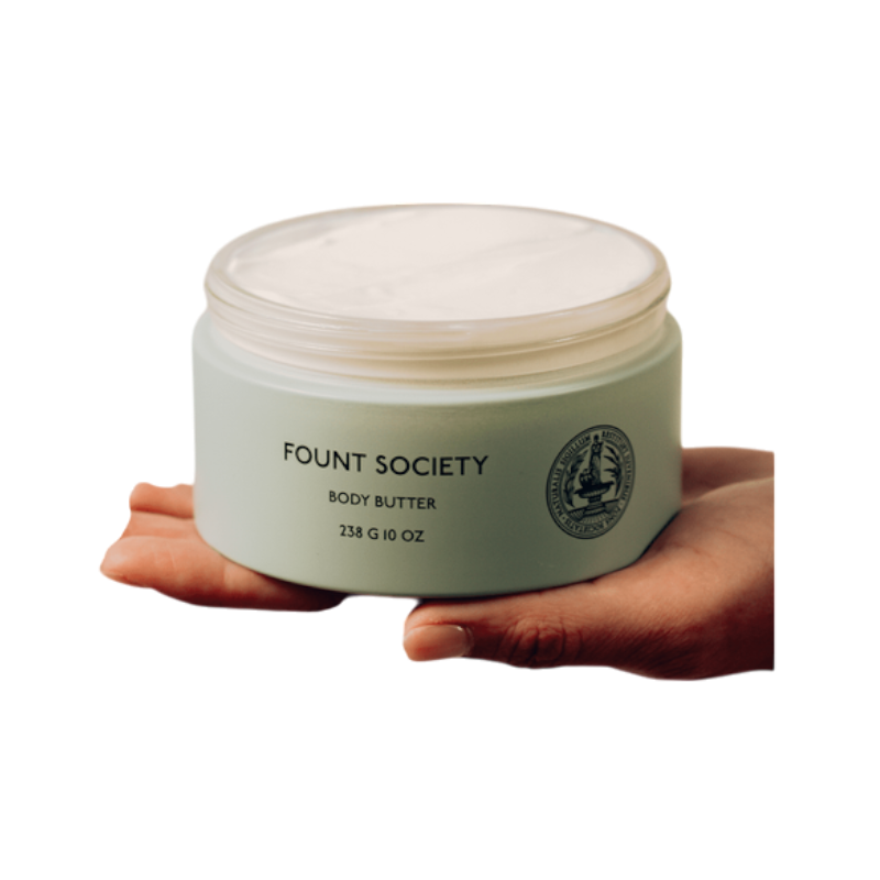 A man with dark hair and a beard stands casually with his hands in his pockets. He is wearing the Cozy Earth Men's Crewneck Sweater in navy blue, paired with gray pants. He looks at the camera with a neutral expression, set against a plain white background. |Color:Eclipse