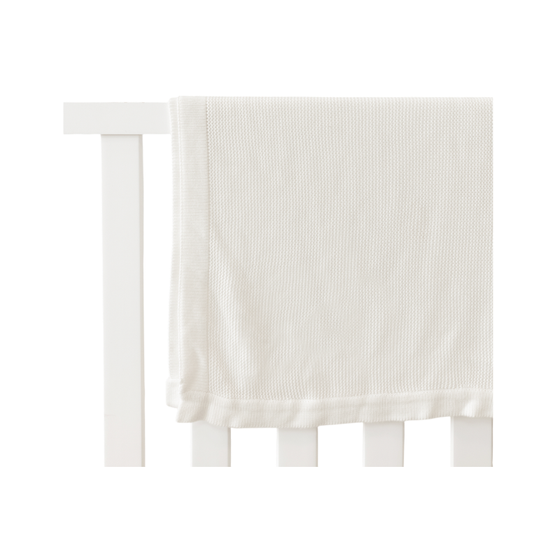 White Cloud Knit Baby Blanket draped over white crib |Color:White