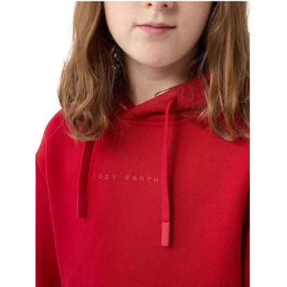 A young child with long blonde hair smiles while wearing a navy blue Kid's CityScape Hoodie by Cozy Earth and matching pants. She has two hair ties, one pink and one blue. The background is plain white. |Color:Eclipse