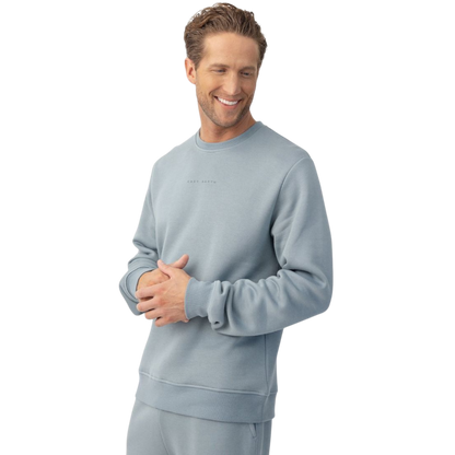 Man wearing Smokey Blue cityscape crewneck with white background |Color:Smokey Blue