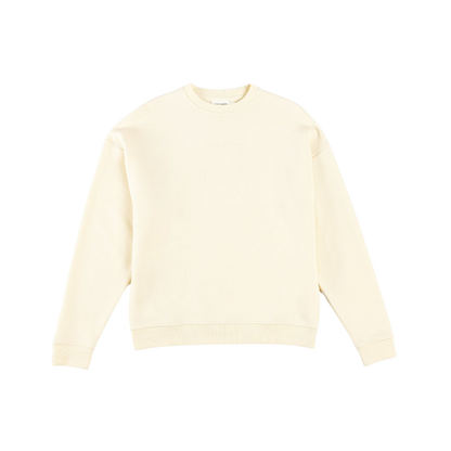 A man with short brown hair is wearing a dark green Men's CityScape Crewneck from Cozy Earth, featuring the words "COLD EARTH" printed on it. He is gazing slightly to the side against a plain white background. |Color:Spruce