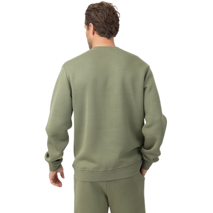 A man with short brown hair is wearing a dark green Men's CityScape Crewneck from Cozy Earth, featuring the words "COLD EARTH" printed on it. He is gazing slightly to the side against a plain white background. |Color:Spruce