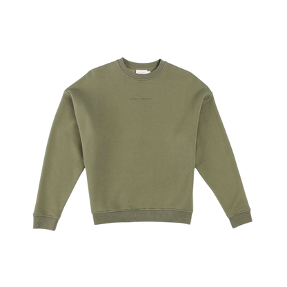 A man with short brown hair is wearing a dark green Men's CityScape Crewneck from Cozy Earth, featuring the words "COLD EARTH" printed on it. He is gazing slightly to the side against a plain white background. |Color:Spruce