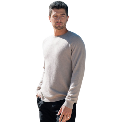 A man with dark hair and a beard stands casually with his hands in his pockets. He is wearing the Cozy Earth Men's Crewneck Sweater in navy blue, paired with gray pants. He looks at the camera with a neutral expression, set against a plain white background. |Color:Eclipse