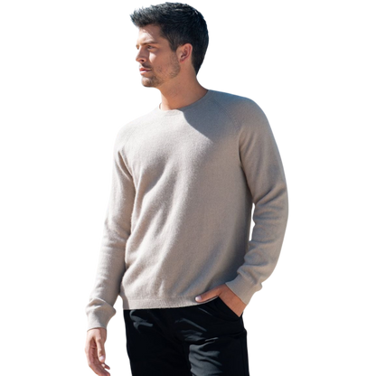 A man with dark hair and a beard stands casually with his hands in his pockets. He is wearing the Cozy Earth Men's Crewneck Sweater in navy blue, paired with gray pants. He looks at the camera with a neutral expression, set against a plain white background. |Color:Eclipse