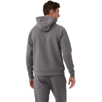 A person wearing the Men's StretchTech Hoodie from Cozy Earth, paired with matching gray pants, stands against a plain white background. The hoodie features drawstrings and a front pocket. The individual is looking forward with a neutral expression. |Color:Coal Heather
