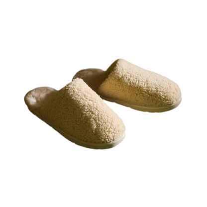 A pair of Puffy Sheep Slippers by Cozy Earth, featuring a cozy tan design with a fuzzy, textured exterior and soft interior, crafted in a slip-on style with rubber soles, set against a plain white background. |Color:Fawn