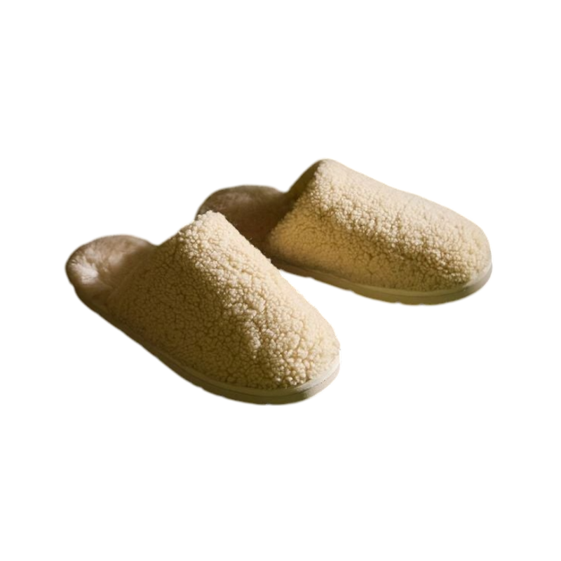 A pair of Puffy Sheep Slippers by Cozy Earth, featuring a cozy tan design with a fuzzy, textured exterior and soft interior, crafted in a slip-on style with rubber soles, set against a plain white background. |Color:Fawn