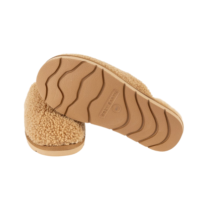 A pair of Puffy Sheep Slippers by Cozy Earth, featuring a cozy tan design with a fuzzy, textured exterior and soft interior, crafted in a slip-on style with rubber soles, set against a plain white background. |Color:Fawn