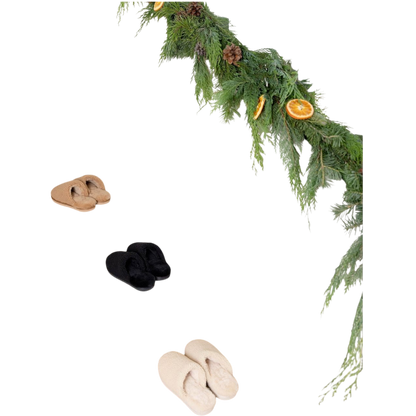 A pair of Puffy Sheep Slippers by Cozy Earth, featuring a cozy tan design with a fuzzy, textured exterior and soft interior, crafted in a slip-on style with rubber soles, set against a plain white background. |Color:Fawn