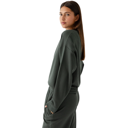 Storm CityScape Pullover Crew. The Pullover is being worn by a female model. Accompanying city scape clothing is being worn to complete the look of the outfit. The photo was taken with a white background. |Color:Storm